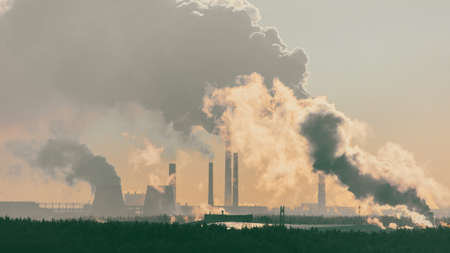 Smoke from the factory at dawn.の写真素材