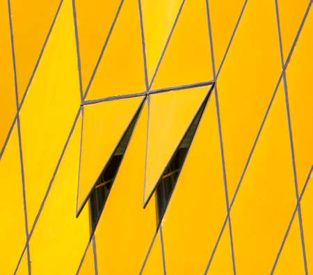 Wall decoration in the house with gold plastic as a background.