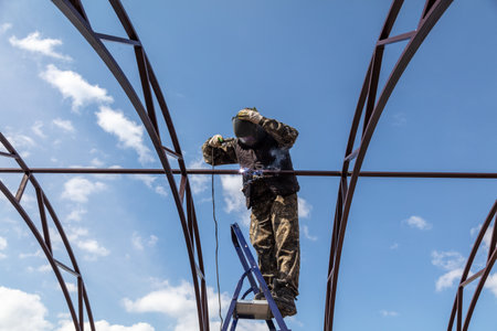 A worker welds metal to the canopy.の写真素材