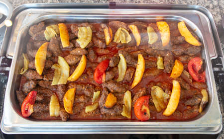 Meat in a tomato with vegetables in a restaurant. Close-upの写真素材