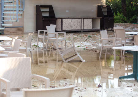 Thatched chairs in a cafe after a tornado.