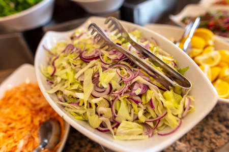 Cabbage and onion salad in a cafe. Close-upの写真素材