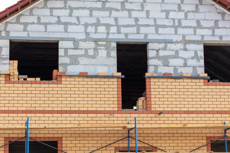 Decorating the outside of the house with decorative bricks. Constructionの写真素材