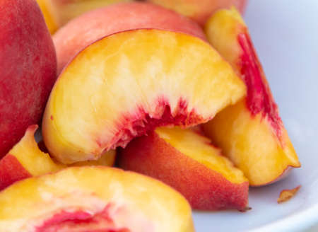 Peach in a plate on a table in a restaurant.の写真素材