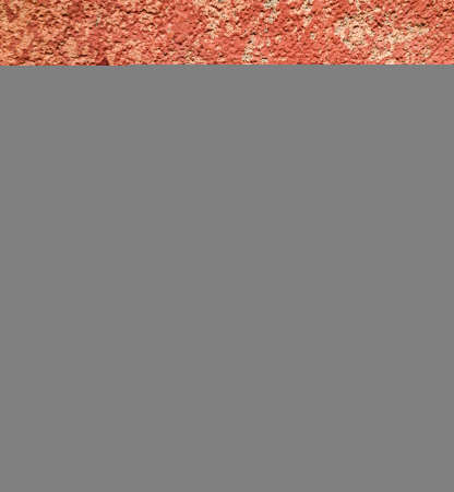 Old red plaster on the wall. Background