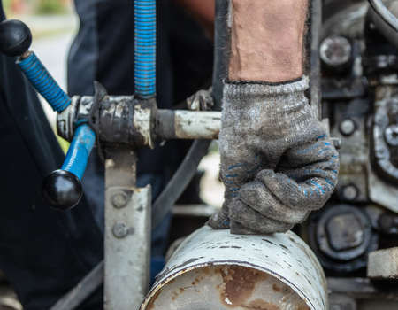 Worker's hand in a glove. Close-upの写真素材