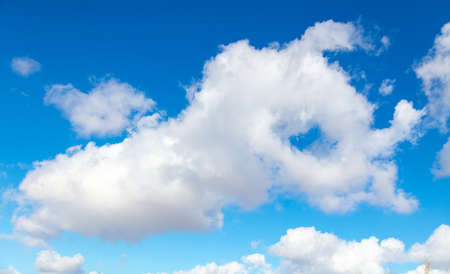 White clouds in the blue sky during the day. Backgroundの写真素材