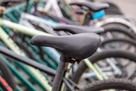 Black bicycle seat in the parking lot.の写真素材