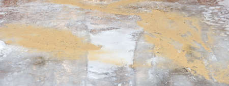 Sand on an icy road in winter.の写真素材