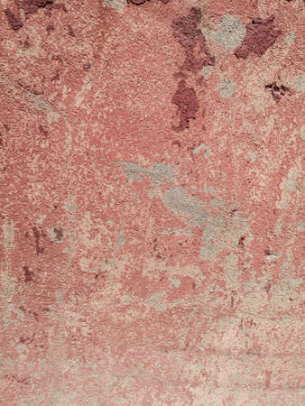 Old red plaster on the wall. Background