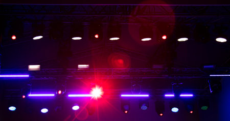 Blue-pink spotlights at a concert at night. Background