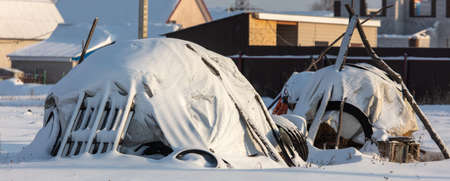 Haystack in the snow in winter.の写真素材
