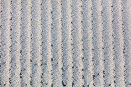 Snow on the roof tiles in winter. Background