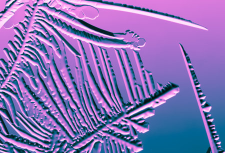 Blue-pink patterns from frost on glass as a background. Close-upの写真素材
