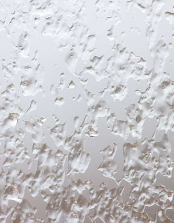 Frozen drops of water on a glass window as an abstract background. Textureの写真素材