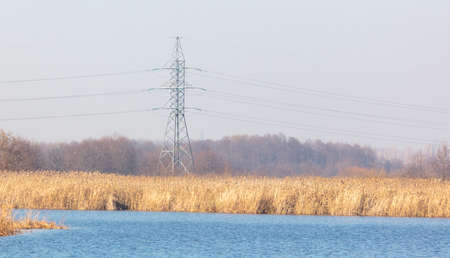 Electric poles near the reservoir.の写真素材