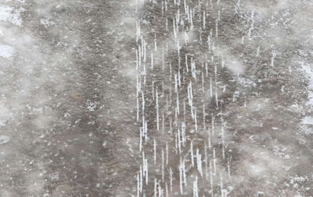 Trace from car wheel spikes as an abstract background.の写真素材