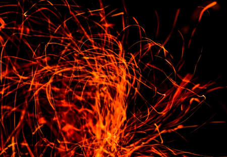 Sparks from fire on a black background.