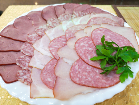 Slicing of different sausages in a plate.の写真素材