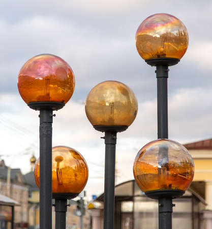 Round glass lanterns in the park.