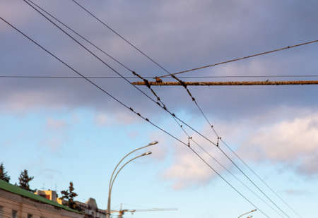 Trolleybus wires against the sky.