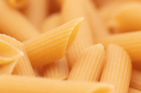 Close-up dry pasta as background. Macro