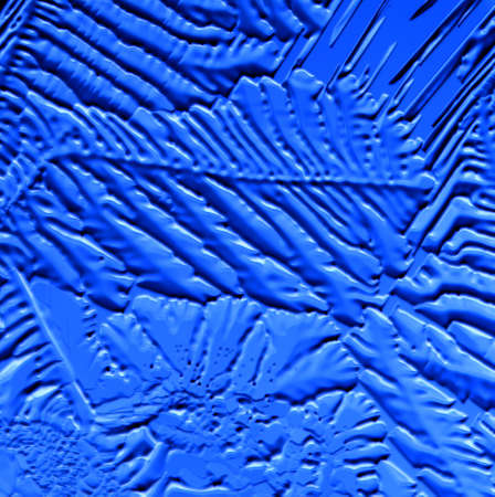 Drawings of ice on blue glass. Abstract backgroundの写真素材