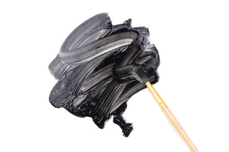 Black paint smeared with a brush on a white background. Abstractionの写真素材
