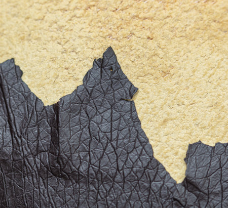 Cracked leatherette on the armchair as a backdrop. Textureの写真素材