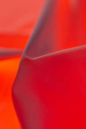 Red material as an abstract background. Texture