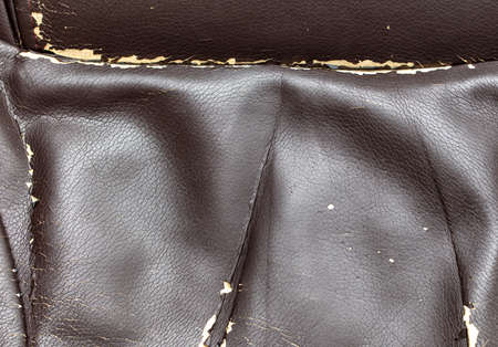 Cracked leatherette on the armchair as a backdrop. Textureの写真素材