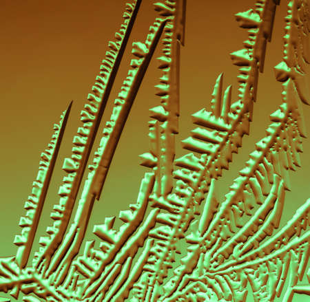 Blue-pink patterns from frost on glass as a background. Close-up