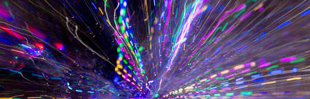 Festive lights in motion as an abstract background. Texture