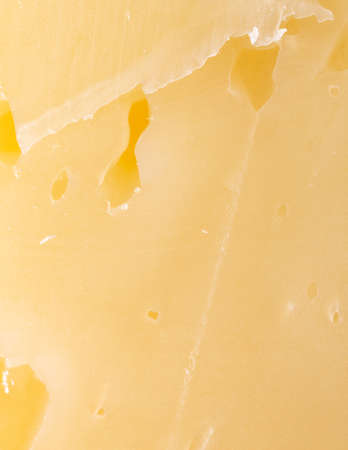 Fresh smoked cheese as background. close-upの写真素材