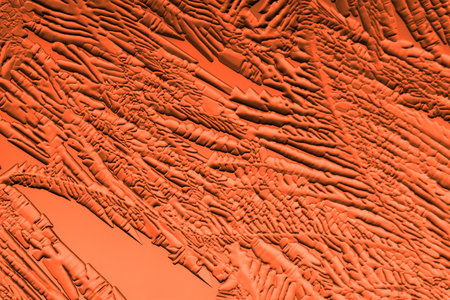 Drawings of ice on red glass.の写真素材