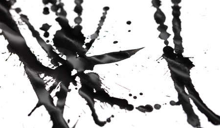 Drops of black paint on a white background. Close-upの写真素材
