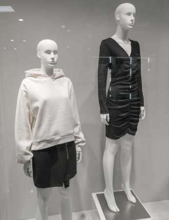 Mannequin of a girl in clothes on a showcase in a market.
