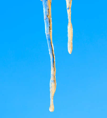 Icicles in winter against a blue sky. Close-upの写真素材
