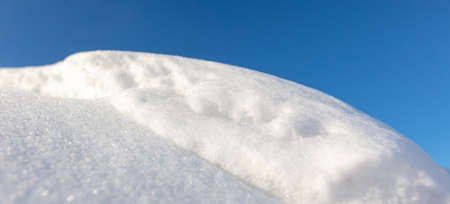 White snow against the blue sky. nature in winterの写真素材