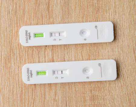 Lipetsk, Russia - January 31, 2022: Positive test for Covid-19 on the table.の写真素材