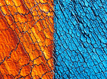 Cracked blue and red paint on fabric as an abstract background. Textureの写真素材