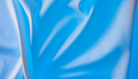 Blue fabric material as an abstract background. Texture