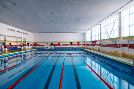 Sports pool with blue water in the hall.