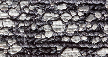Cracked white paint on fabric as an abstract background. texture