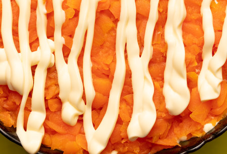 Mayonnaise on boiled carrots in a salad. backgroundの写真素材