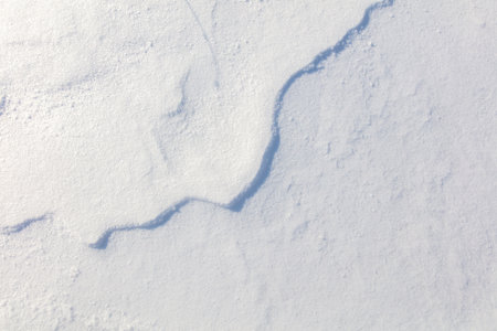 Snowy crust as an abstract background. textureの写真素材