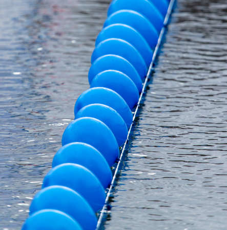 Blue balls float on the water in the river.の写真素材