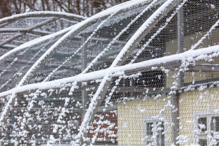 Metal enclosure in the zoo in the snow. Winterの写真素材