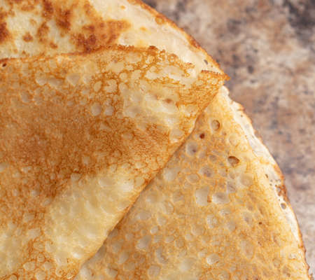 Pan fried pancake as a background. close-up