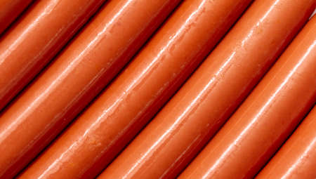 Fresh boiled meat sausages as background. close-up